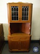A mid 20th century teak corner display cabinet