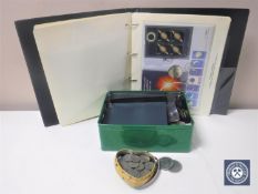 An album of coin first day covers together with a tin of assorted crowns,