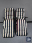 A pair of folding garden armchairs