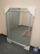 A contemporary all glass bevelled mirror,