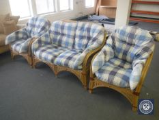 A bamboo and wicker three piece conservatory suite