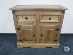 A Mexican pine double door cabinet