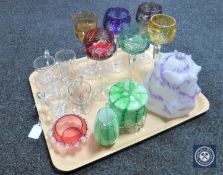 A tray of coloured hock glasses, cranberry glass bowl, green glass sugar basin and jug,