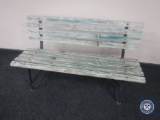 A wooden slatted garden bench