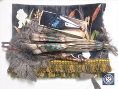 A Victorian folding parasol together with a peacock feather hand fan and an antique embroidered