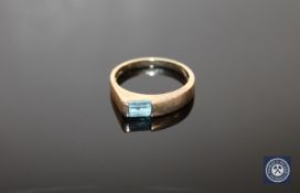A 9ct gold ring set with a blue zircon,