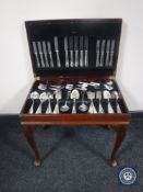 A mahogany leather topped cutlery canteen containing Sheffield Cooper Ludlum cutlery