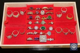 A collection of forty silver dress rings, variously set with amethysts, malachite, cubic zirconia,