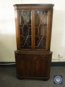 A mahogany corner display cabinet