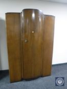 A 20th century oak single door wardrobe
