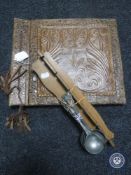 An embossed leather photograph album together with a set of six spoons on rack
