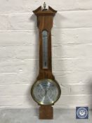A Comitti of London walnut cased barometer