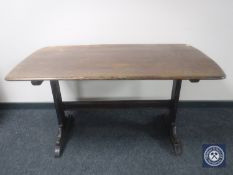 An Ercol elm refectory dining table