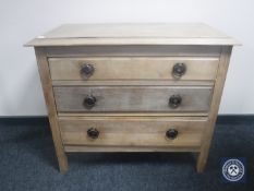 An early 20th century pine three drawer chest