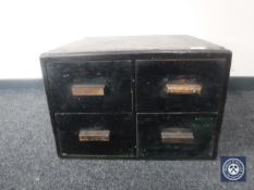 A mid 20th century wooden four drawer index chest