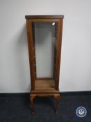 A square glazed curio cabinet