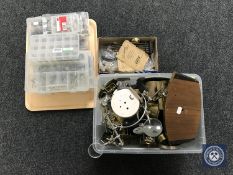 Two boxes and a tray containing a large quantity of clock parts including movements, faces, hands,