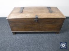 An oak chest with iron fittings