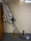 Two Moet de Chandon champagne outdoor pub parasols with cases