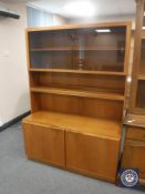 A mid 20th century teak sliding door bookcase