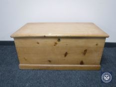 A stripped pine blanket box