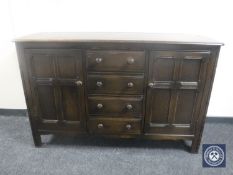 A stained Ercol elm sideboard
