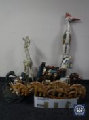 A box of wooden ornaments and figures