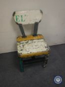 An oil drum dining chair