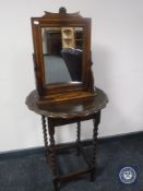 A shaped oak barley twist occasional table together with an Edwardian mirror with shelf