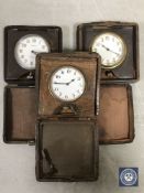 Three leather cased eight day travel clocks