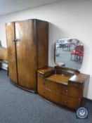 A 20th century walnut bow-fronted double door wardrobe with matching dressing chest and 4'6