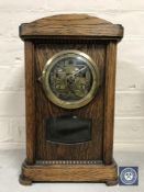 A mahogany mantel clock with silvered dial together with an oak bracket clock (parts missing)