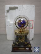 A Franklin Mint Millennium Edition Royal Geographical Society clock under glass dome,