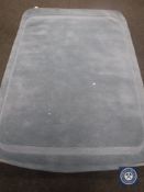 A hand tufted plain loop cut light blue rug, 160 cm x 230 cm,