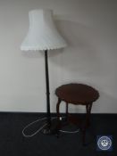 A mahogany shaped occasional table together with a mahogany standard lamp with shade