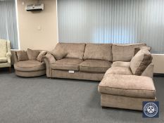 An L-shaped corner settee and footstool with a loving chair, plus four scatter cushions,