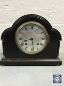 A mahogany cased mantel clock with silvered dial,