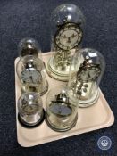 A tray containing six assorted anniversary clocks under shades CONDITION REPORT: One