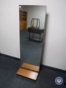 A teak framed cheval mirror