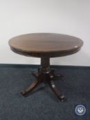 A Victorian inlaid mahogany pedestal breakfast table