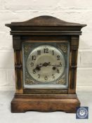 A continental mahogany bracket clock with brass and silvered dial,