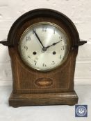 An inlaid oak cased bracket clock with pendulum and key