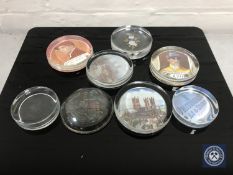 A box containing six vintage glass paperweights,