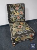 A 20th century bedroom chair upholstered in a floral tapestry fabric