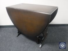 An oak drop leaf dining table