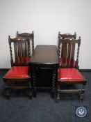 An early 20th century oak drop leaf barley twist table together with four similar chairs