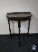 An oak Chapmans Siesta D-shaped hall table