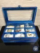 A box of costume brooches and 9ct gold earrings