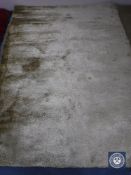 A hand tufted shaggy ivory rug,
