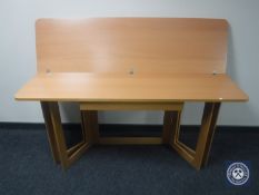 A pine effect foldover hall/ dining table fitted a drawer